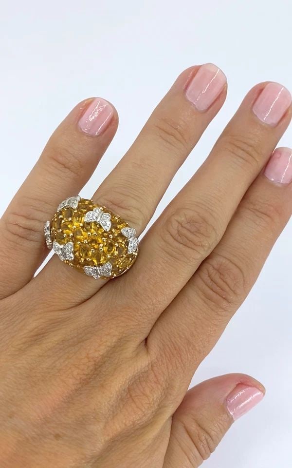 14K WHITE GOLD CITRINE DIAMOND BUTTERFLY DOME RING: 14K WHITE GOLD CITRINE DIAMOND BUTTERFLY DOME RING CIRCA 1980s MATERIALS 14k Gold GEMSTONE Citrine, Diamond WEIGHT 12.3 Grams MEASUREMENT Top - 13/16" RING SIZE 7 HALLMARKS 14K, D 080 ITEM DETAILS 14k