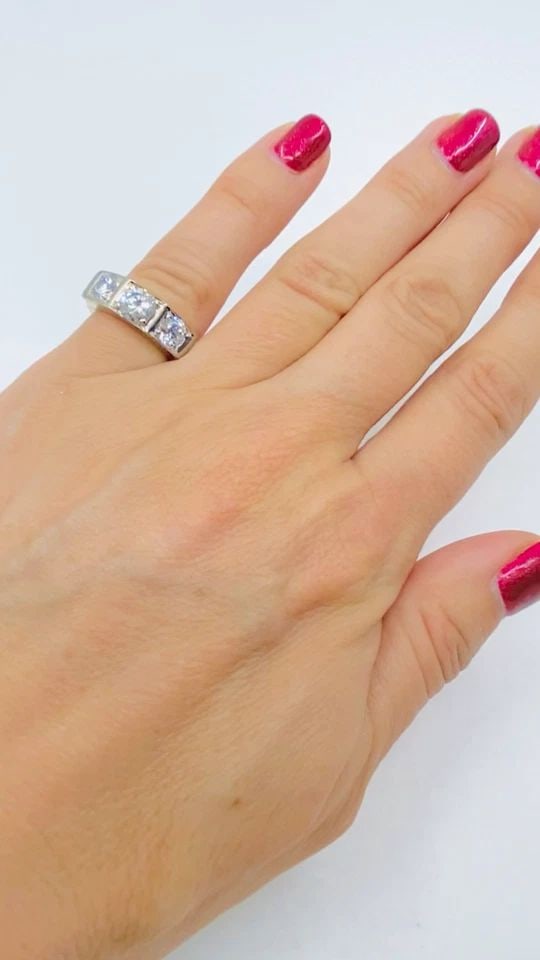 VINTAGE THREE STONE DIAMOND RING 14K GOLD: VINTAGE THREE STONE DIAMOND RING 14K GOLD Product details: DESIGNER: Unknown CIRCA: 1960s MATERIALS: 14k Yellow & White Gold GEMSTONE: Round Brilliant Cut Diamond WEIGHT: 7 Grams RING SIZE: 5.25 MEASU