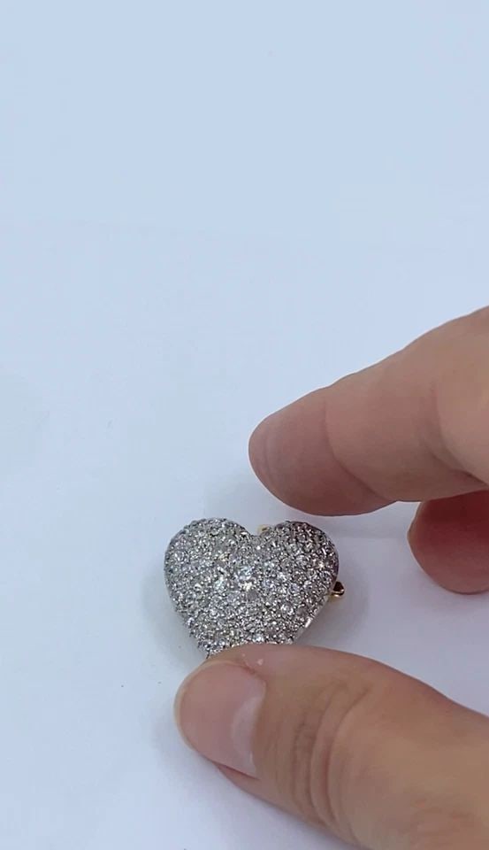 CARTIER 18K GOLD PAVÉ DIAMOND HEART BROOCH-PENDANT: Cartier 18k Gold Pavé Diamond Heart Brooch-Pendant ES UTOO Product details: Designer: Cartier Materials: 18k Gold Weight: 7.4 Grams Gemstone: Diamonds Measurement: 7/8" x 7/8" Hallmarks: Cartier ITEM
