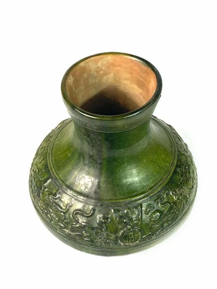 200 AD CHINESE JAN DYNASTY CERAMIC VASE: 200 AD CHINESE JAN DYNASTY CERAMIC VASE 200 AD CHINESE JAN DYNASTY CERAMIC VASE The vase is made out of green ceramic, featuring animal motif. Height: 14.5 in. (368.3 mm) Width: 12 in. (304.8 mm) Weig