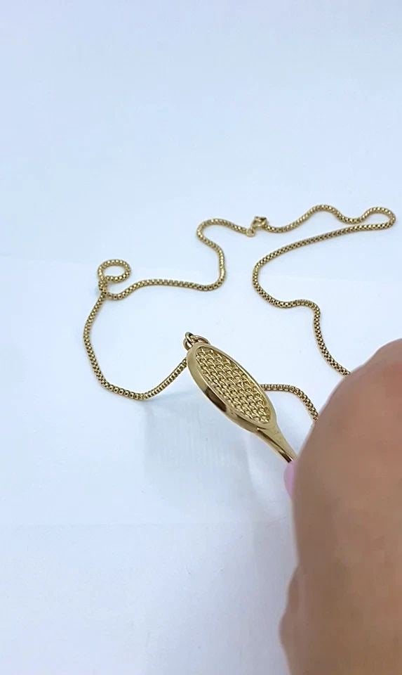 VINTAGE CARTIER 14K GOLD TENNIS RACKET PENDANT & 14K CHAIN (UNSIGNED) NECKLACE: VINTAGE CARTIER 14K GOLD TENNIS RACKET PENDANT & 14K CHAIN (UNSIGNED) NECKLACE DESIGNER: Cartier CIRCA: Late 20th Century MATERIALS: 14k Gold WEIGHT: Pendant - 14.1 Grams, Chain - 6.2 Grams MEASUREMEN