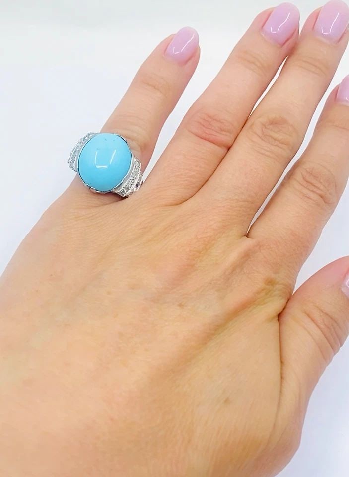 FRENCH TURQUOISE RING DIAMOND 18K WHITE GOLD: FRENCH TURQUOISE RING DIAMOND 18K WHITE GOLD Product details: CIRCA: Early 20th Century MATERIALS: 18k Gold GEMSTONE: Turquoise, Diamond WEIGHT: 6.3 Grams RING SIZE: 5.25 MEASUREMENTS: Stone - 1/2" x 