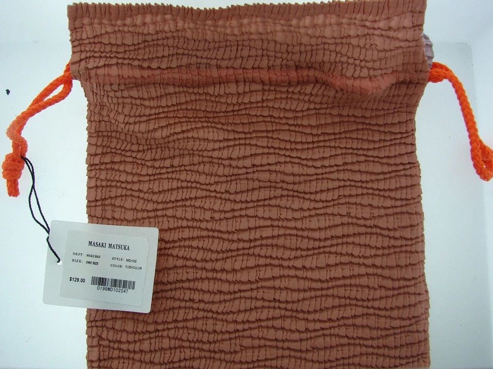 BRAND NEW WITH TAG MASAKI MATSUKA ONE SIZE MAGIC BAG FLESH COLOR $129: BRAND NEW WITH TAG MASAKI MATSUKA ONE SIZE MAGIC BAG FLESH COLOR BRAND NEW WITH TAG MASAKI MATSUKA ONE SIZE MAGIC BAG FLESH COLOR BRAND NEW WITH TAG MEASURES 11 1/2'' X 8'' ORANGE STRAP A perfect gift