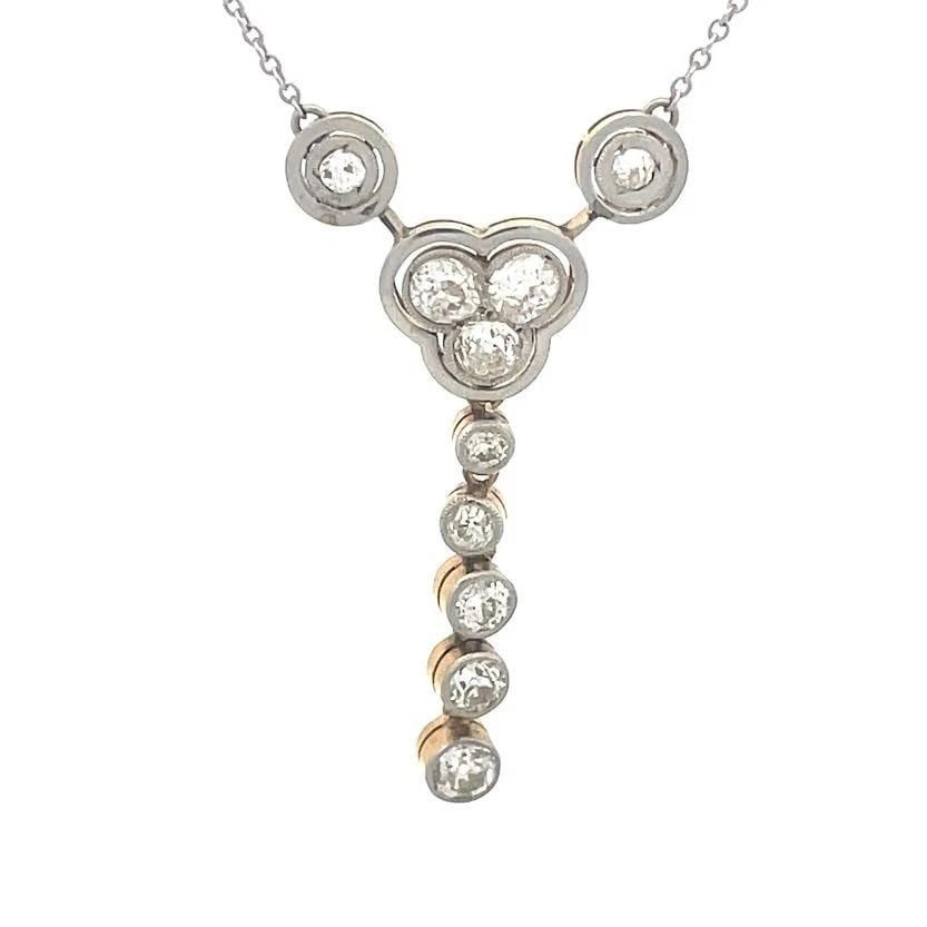 TIFFANY & CO. GOLD PEARL NECKLACE 18K YELLOW FLORAL PENDANT: TIFFANY & CO. GOLD PEARL NECKLACE 18K YELLOW FLORAL PENDANT The product is a Tiffany & Co. 18k yellow gold pearl necklace with a floral pendant. It features a beautiful white pearl as the main stone, 