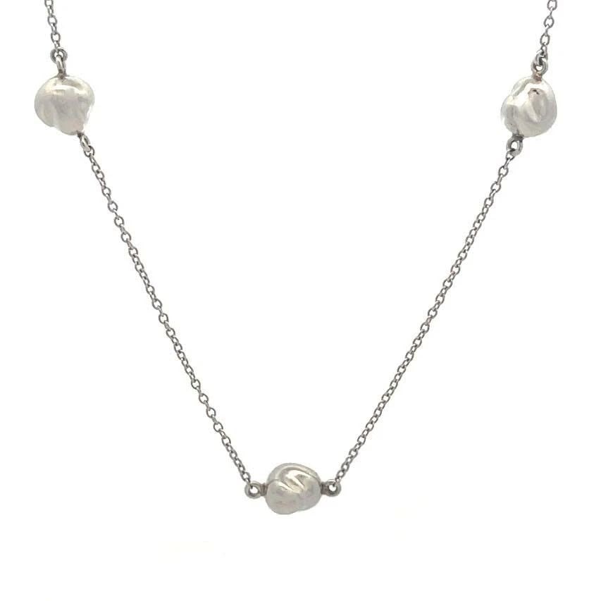 BVLGARI BULGARI GOLD WHEEL PENDANT COLORED DOUBLE STYLE: BVLGARI BULGARI GOLD WHEEL PENDANT COLORED DOUBLE STYLE The lovely Bvlgari pendant is a luxurious and stylish piece of jewelry featuring a wheel-shaped pendant crafted from 18k white gold. This signat