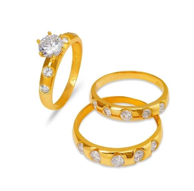 NEW 14K YELLOW GOLD WEDDING TRIO RING SET: NEW 14K YELLOW GOLD WEDDING TRIO RING SET 14K Yellow Gold Ladies band and engagement ring is size 7 Men's ring is size 10 Rings Also Sold Separately Available in White Gold Weight: 7.4 Grams