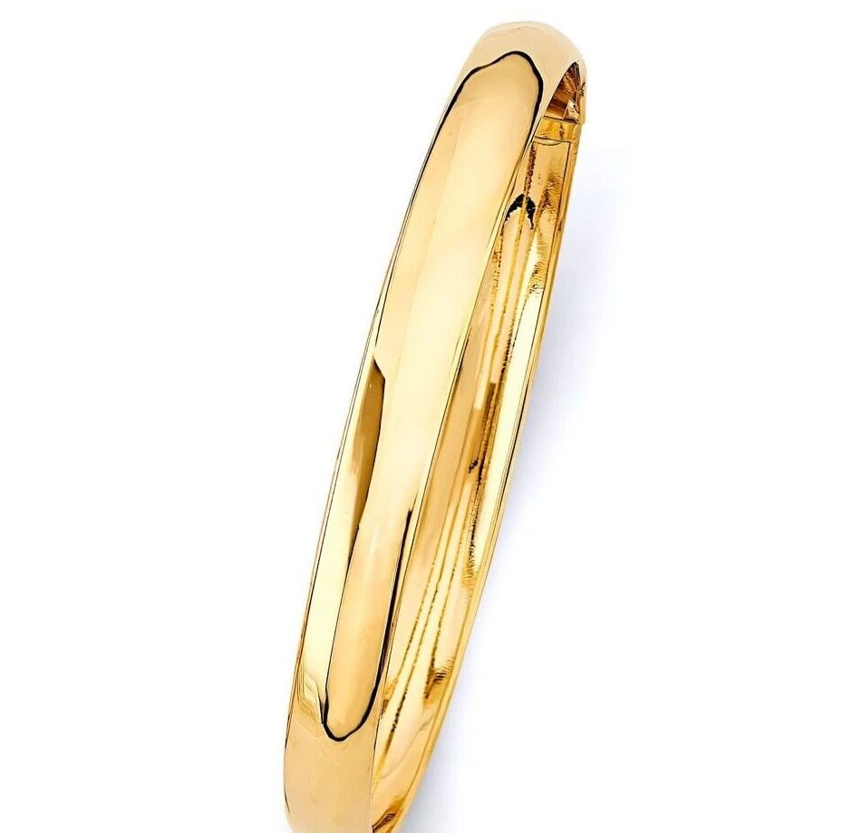 NEW 14K YELLOW GOLD 8MM PLAIN FLEXIBLE BANGLE: NEW 14K YELLOW GOLD 8MM PLAIN FLEXIBLE BANGLE 8MM PLAIN FLEXIBLE BANGLE NEW 14K YELLOW GOLD LENGTH - 7in Apx WEIGHT - 6.9g .