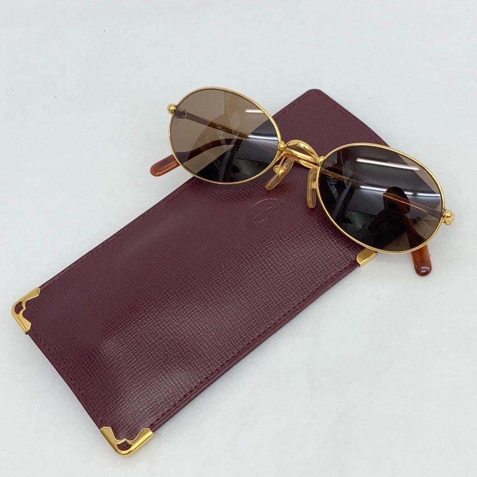 AUTHENTIC CARTIER SATURNE 51 19 135 GP VINTAGE OVAL SUNGLASSES TRINITY FRAMES: AUTHENTIC CARTIER SATURNE 51 19 135 GP VINTAGE OVAL SUNGLASSES TRINITY FRAMES AUTHENTIC CARTIER SATURNE 51 19 135 GP VINTAGE OVAL SUNGLASSES TRINITY FRAMES Lens Width: 51mm Bridge Width: 19mm Temple L