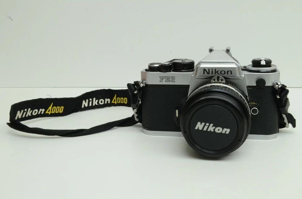 AUTHENTIC NIKON FE2 CAMERA 50MM LENS & NIKKOR F/4 ZOOM-NIKKOR 35~100MM F/3.5~4.5 (1 of 2)