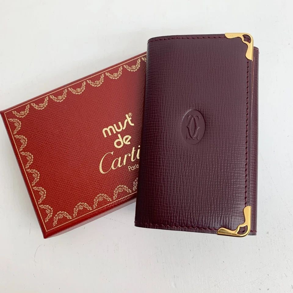 AUTHENTIC CARTIER BURGUNDY LEATHER KEY RING WALLET LOGO GP VINTAGE CARD HOLDER 3: AUTHENTIC CARTIER BURGUNDY LEATHER KEY RING WALLET LOGO GP VINTAGE CARD HOLDER 3 AUTHENTIC CARTIER BURGUNDY LEATHER KEY RING WALLET LOGO GP VINTAGE CARD HOLDER 3 Leather, Gold Plated Signature Emblem 
