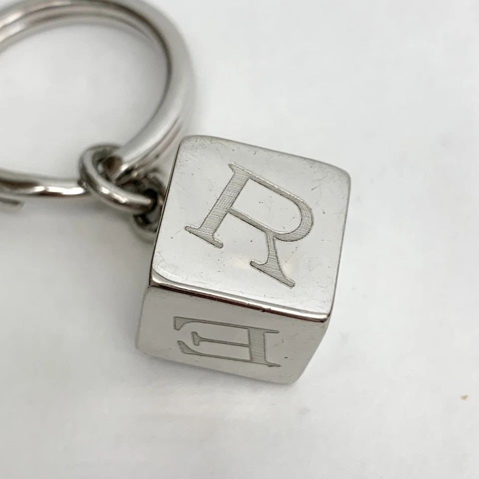 AUTHENTIC CARTIER KEYCHAIN SP LETTER CUBE SILVER DANGLE BAG KEY RING ACCESSORY: AUTHENTIC CARTIER KEYCHAIN SP LETTER CUBE SILVER DANGLE BAG KEY RING ACCESSORY Cartier Key Chain, Bag Charm Fashion, Chic Key Ring, Clip, Accessory Silver Plated Manufactured: Spain Length: 5.7 cm Emb