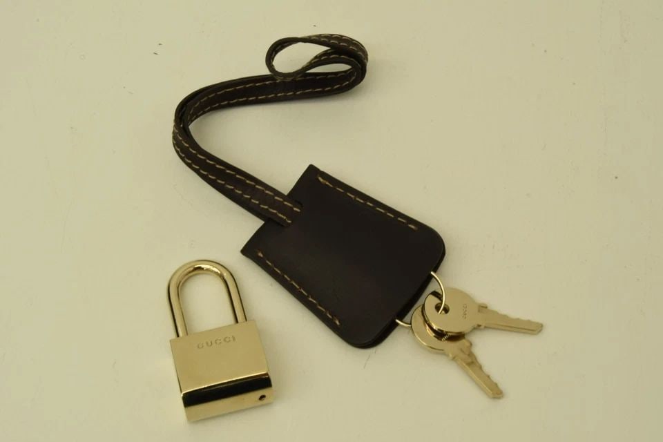 AUTHENTIC GUCCI BROWN LEATHER BAG CHARM SP LOCK KET HIDER FASHION ACCESSORY (1 of 2)