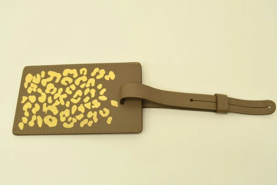 AUTHENTIC CARTIER DANGLING LEATHER ANIMAL PRINT GRAY/BROWN LUGGAGE TAG ACCESSORY: AUTHENTIC CARTIER DANGLING LEATHER ANIMAL PRINT GRAY/BROWN LUGGAGE TAG ACCESSORY Authentic Cartier Dangling Leather Animal Print Gray/Brown Luggage Tag Accessory Authentic Cartier Dangling Leather Ani