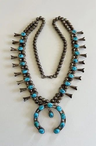 VTG NAVAJO STERLING SILVER SLEEPING BEAUTY TURQUOISE SQUASH BLOSSOM NECKLACE 24": Vtg Navajo Sterling Silver Sleeping Beauty Turquoise Squash Blossom Necklace 24" This Amazing necklace features huge specimens of Natural Blue Sleeping Beauty Turquoise, secure in a Smooth bezel. Neck