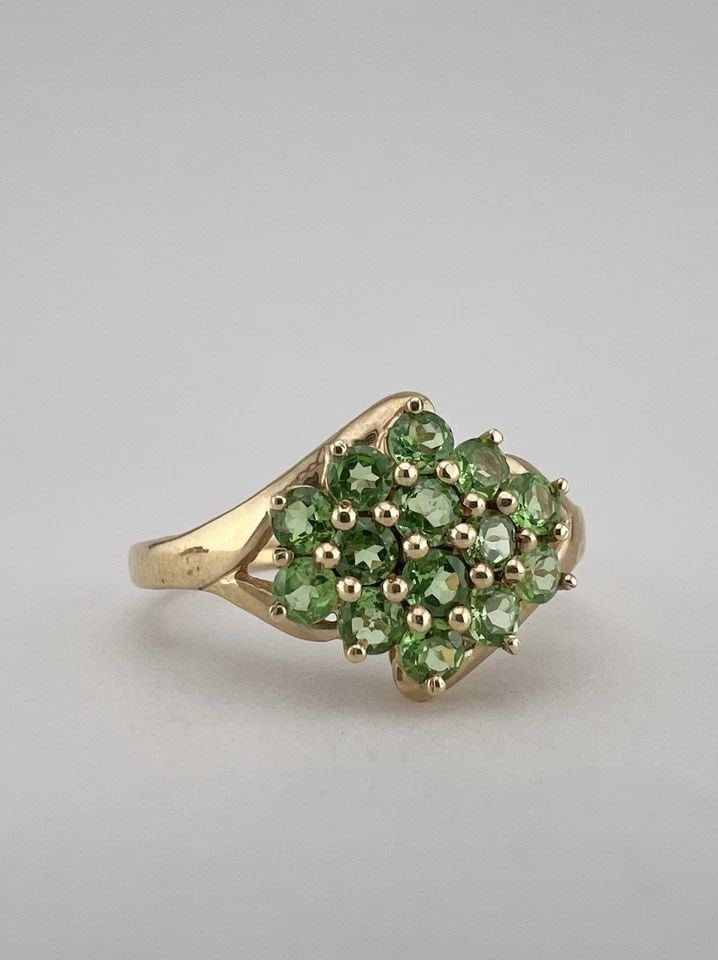 DESIGNER 14K YELLOW GOLD NATURAL GREEN TSAVORITE CLUSTER RING: DESIGNER 14K YELLOW GOLD NATURAL GREEN TSAVORITE CLUSTER RING Designer 14k Yellow Gold Natural Green Tsavorite Cluster Ring Ring Size: 9.25 - Can Be Resized Metal: 14k Yellow Gold - Tested & Hallmarke
