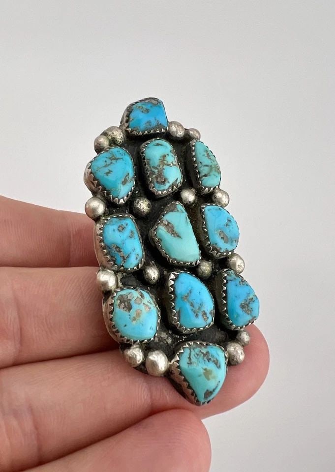 HUGE VTG ZUNI STERLING SILVER NEVADA TURQUOISE CLUSTER WOMEN'S RING 2 3/8": HUGE Vtg Zuni Sterling Silver Nevada Turquoise Cluster Women's Ring 2 3/8" Ring Size: 7 Weight is 18.9 Grams on my scale Metal: Sterling Silver Ring is 2 3/8" Tall In the Center by 1 1/4" Wide Amazing