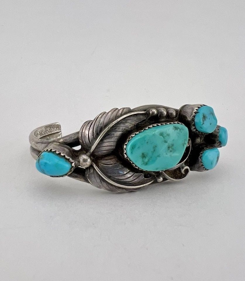 VTG R.TOM NAVAJO STERLING SILVER SLEEPING BEAUTY TURQUOISE STAMPED CUFF BRACELET: Vtg R.TOM Navajo Sterling Silver Sleeping Beauty Turquoise Stamped Cuff Bracelet Cuff is Around 5 1/8" tip to Tip and has a 1 1/4" Wide Adjustable Gap Cuff Is 1" Wide In the Center Weight is 35.0 Gram