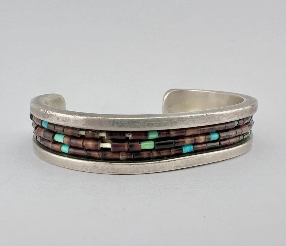 RARE VINTAGE NAVAJO STERLING SILVER 3 ROLLED HAND CUT HEISHI CUFF BRACELET: RARE VINTAGE NAVAJO STERLING SILVER 3 ROLLED HAND CUT HEISHI CUFF BRACELET RARE Vintage Navajo Sterling Silver 3 Rolled Hand Cut Heishi Cuff Bracelet Cuff is 5" tip to Tip and has a 1 1/2" Wide Gap Cu