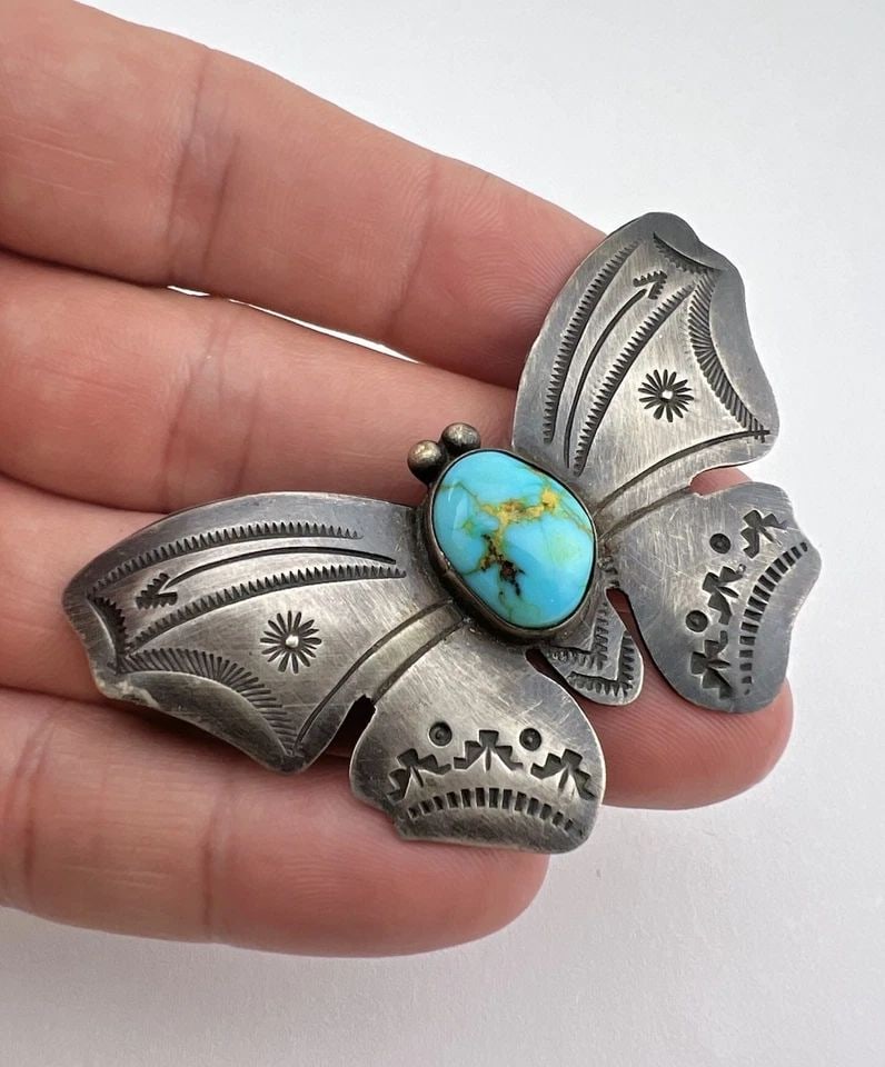 DEAN SANDOVAL NAVAJO STERLING SILVER ROYSTON TURQUOISE STAMPED BUTTERFLY BROOCH: Vtg Dean Sandoval Navajo Sterling Silver Royston Turquoise Stamped Butterfly Brooch Size: 2.5" Wide By 1 5/8" Tall Metal: Sterling Silver Weight is 15.0 Grams on my scale Amaizng Stamp work and High-G