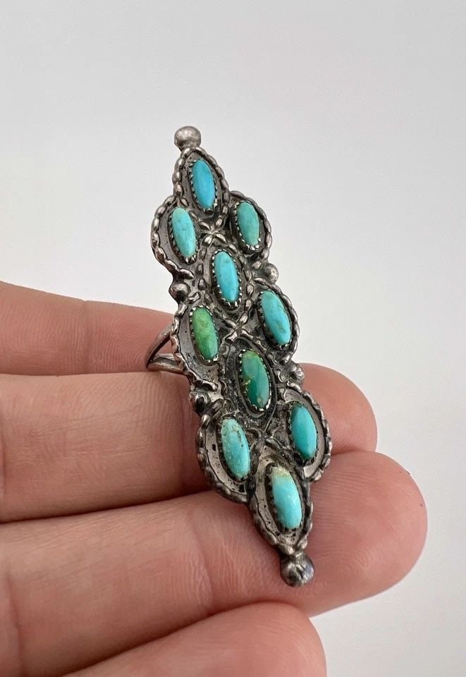 HUGE VTG NAVAJO STERLING SILVER NEEDLE POINT TURQUOISE CLUSTER LONG RING 2 1/8": HUGE Vtg Navajo Sterling Silver Needle Point Turquoise Cluster Long Ring 2 1/8" Ring Size: 5 - Can Be re Sized Weight is 9.7 Grams on my scale Metal: Sterling Silver Ring is 2 1/8" Tall In the Center 