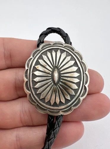 CALVIN MARTINEZ NAVAJO STERLING SILVER DEEP STAMPED OVAL CONCHO BOLO TIE 1 5/8": CALVIN MARTINEZ NAVAJO STERLING SILVER DEEP STAMPED OVAL CONCHO BOLO TIE 1 5/8" Vintage Calvin Martinez Navajo Sterling Silver Deep Stamped Oval Concho Bolo Tie 1 5/8" Size: 1 5/8" Tall by 1 1/2" Wide