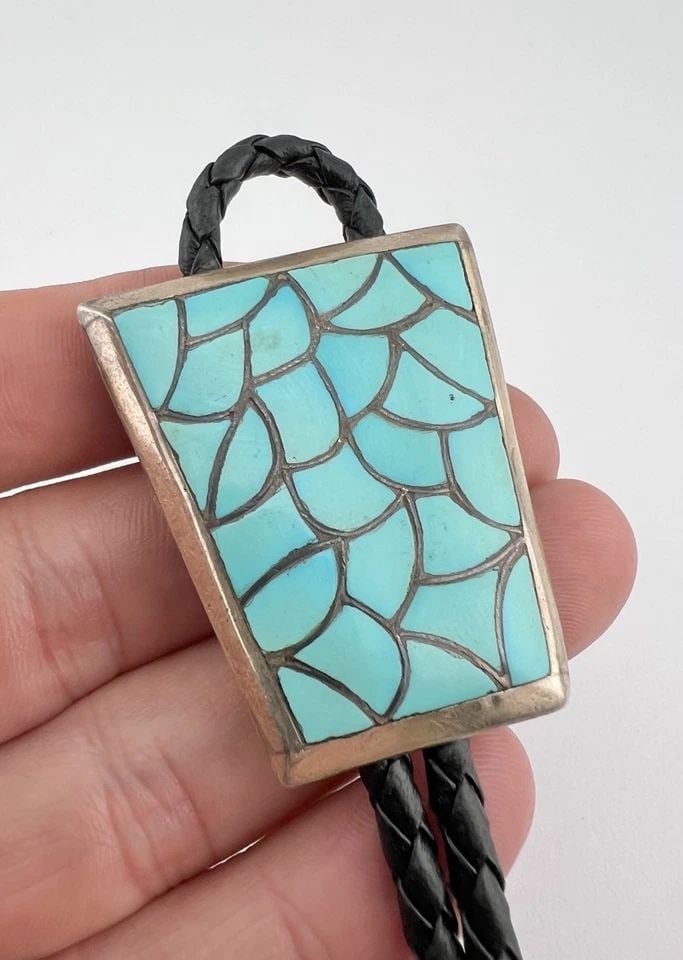 VINTAGE RHC ZUNI SILVER AND TURQUOISE FISHSCALE CHANNEL INLAY BOLO TIE 1.75": VINTAGE RHC ZUNI SILVER AND TURQUOISE FISHSCALE CHANNEL INLAY BOLO TIE 1.75" Vintage RHC Zuni Silver and Turquoise Fishscale Channel Inlay Bolo Tie 1.75" Size: 1 3/4" Tall by 1 1/2" Wide At The Top We