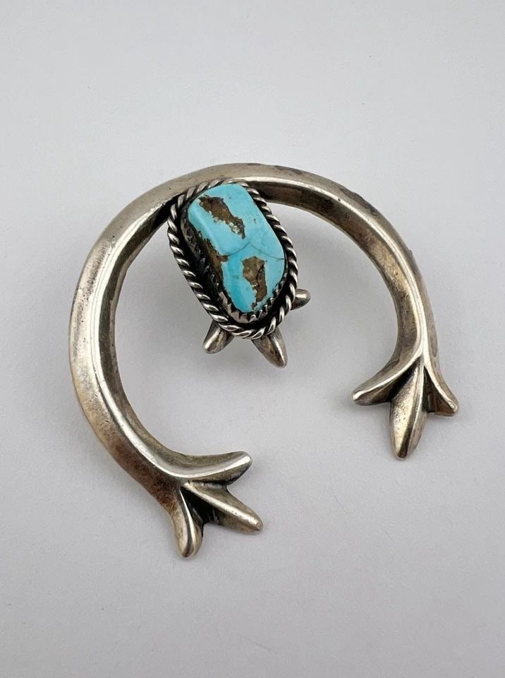 VINTAGE NAVAJO SANDCAST STERLING SILVER BLUE GEM TURQUOISE NAJA PENDANT 2": Vintage Navajo Sandcast Sterling Silver Blue Gem Turquoise NAJA Pendant 2" Size: 1 7/8" Tall By 2" Wide Metal: Sterling Silver Weight is 20.4 Grams on my scale Amazing Natural Blue Gem Turquoise Gemst