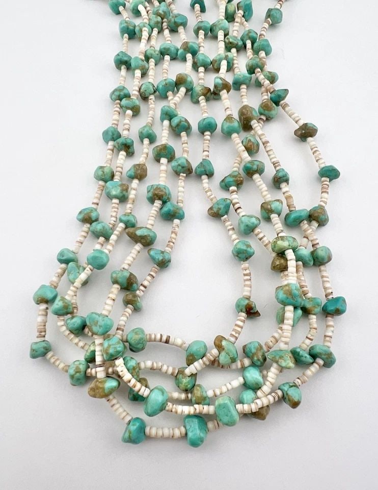 SANTO DOMINGO KEWA NEVADA TURQUOISE & OLIVE SHELL 5 STRAND HEISHI NECKLACE 28": Vtg Santo Domingo Kewa Nevada Turquoise & Olive Shell 5 Strand Heishi Necklace 28" The Turquoise Stones are From 7mm to 8mm Wide Necklace Is 5 Strands Total weight is 67.8 Grams on my scale Condition: