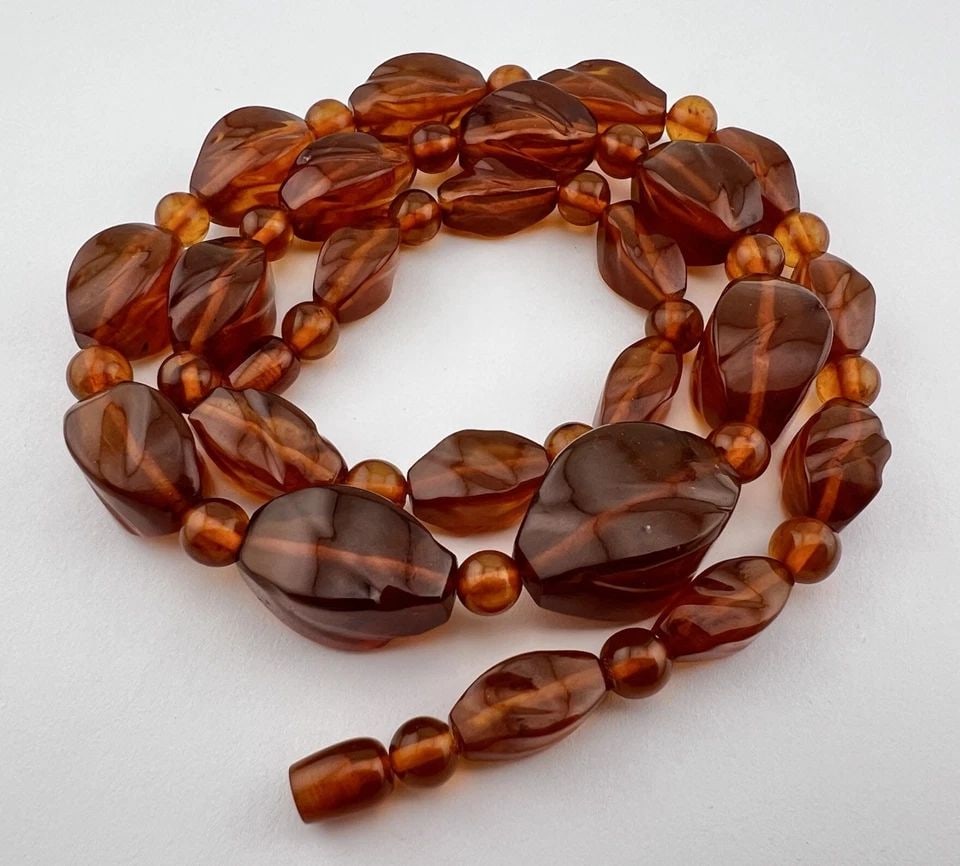 VINTAGE NATURAL BALTIC COGNAC CARVED HONEY AMBER NECKLACE 28.25" - 63G: VINTAGE NATURAL BALTIC COGNAC CARVED HONEY AMBER NECKLACE 28.25" - 63G Vintage Natural Baltic Cognac Carved Honey Amber Necklace 28.25" - 63g Size: 28 1/4" Long Round Beads Size: Over 8mm Wide Carved 