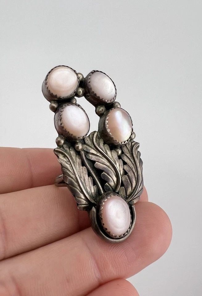 HUGE VTG NAVAJO STERLING SILVER PINK MOTHER OF PEARL CLUSTER STAMPED RING 2": HUGE Vtg Navajo Sterling Silver Pink Mother Of Pearl Cluster Stamped Ring 2" Ring Size: 8.5 - Can Be Re Sized Weight is 11.5 Grams on my scale Metal: Sterling Silver Ring is 2" Tall In the Center Amaz