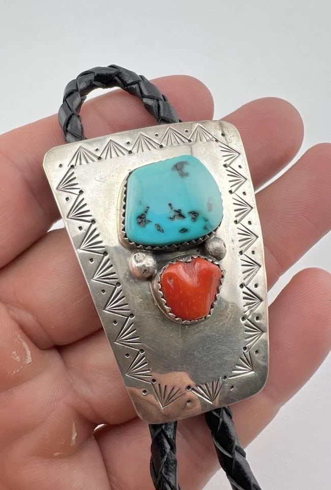 VTG NAVAJO STERLING SILVER NATURAL TURQUOISE & RED CORAL STAMPED BOLO TIE 2": VTG NAVAJO STERLING SILVER NATURAL TURQUOISE & RED CORAL STAMPED BOLO TIE 2" Vtg Navajo Sterling Silver Natural Turquoise & Red Coral Stamped Bolo Tie 2" Size: 2" Tall by 1 1/2" Wide At The Top Weight
