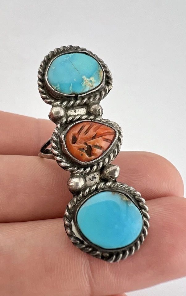 VTG NAVAJO STERLING SILVER TURQUOISE & CARVED CORAL STAMPED LONG RING 1 7/8": VTG NAVAJO STERLING SILVER TURQUOISE & CARVED CORAL STAMPED LONG RING 1 7/8" Vtg Navajo Sterling Silver Turquoise & Carved Coral Stamped Long Ring 1 7/8" Size: 6.5- Can Be Re Sized Weight is 8.8 Grams