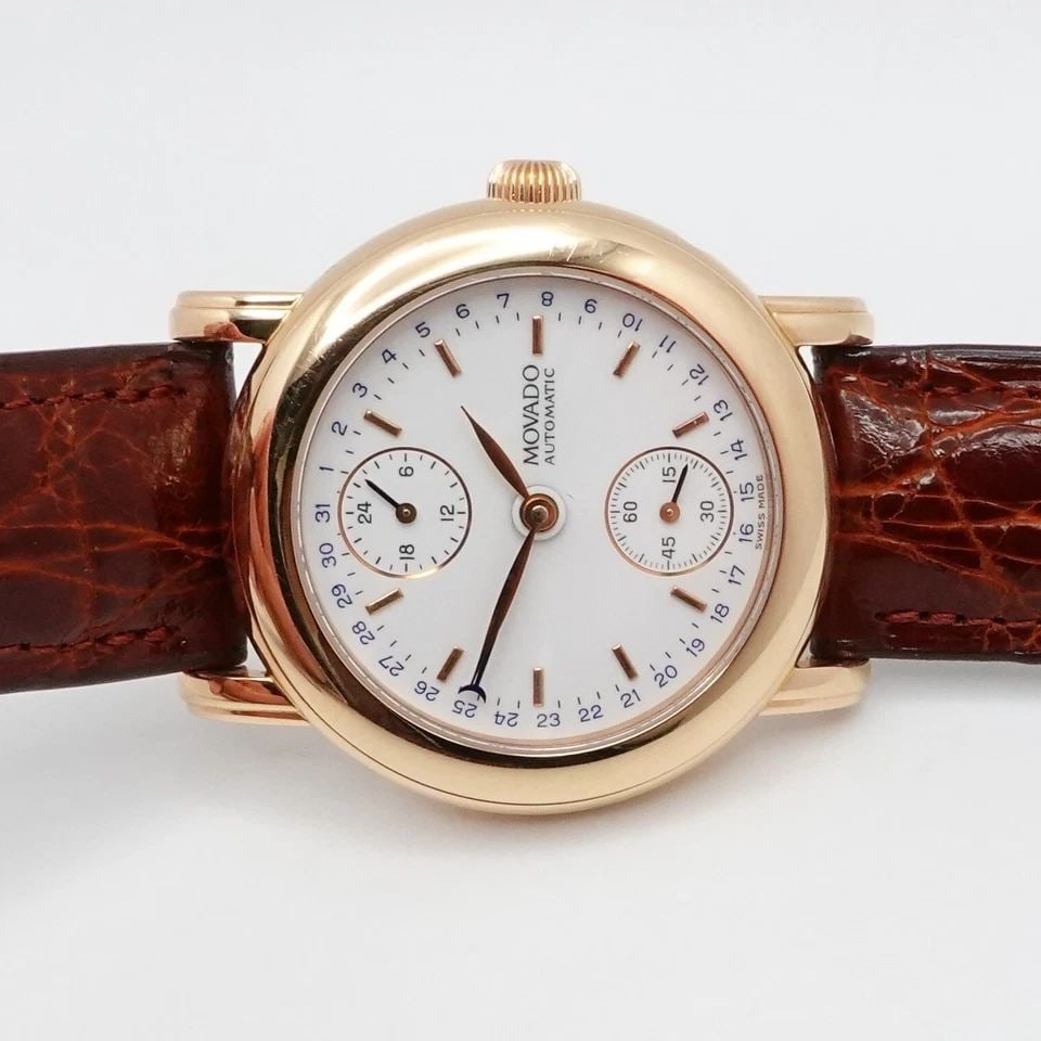 MOVADO 1881 SUISSE 44.B2.870 18K YELLOW GOLD AUTOMATIC WATCH - 36MM BOX & TAG: MOVADO 1881 SUISSE 44.B2.870 18K YELLOW GOLD AUTOMATIC WATCH - 36MM BOX & TAG Movado 1881 Museum Collection Suisse No. 064 Ref# 44.B2.870 18K Yellow Gold Back Case Automatic Watch With Brown Selected 