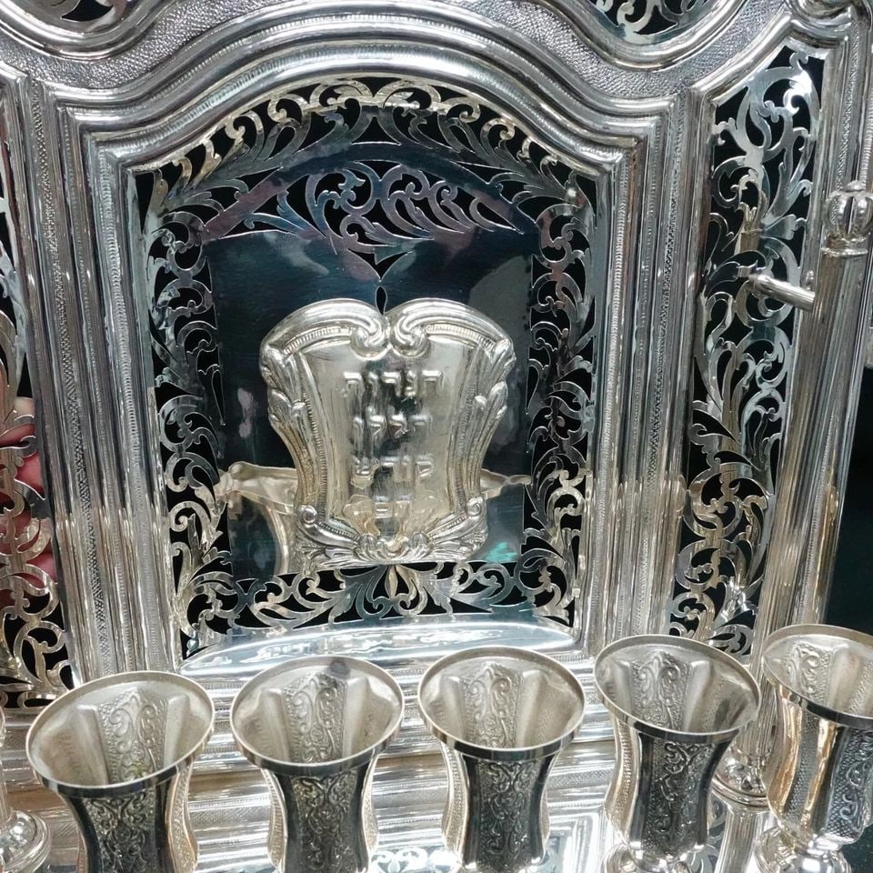 ANTIK STERLING SILVER LEAF ORNATE CHASED CROWN WALL MENORAH 16" X 12.25": ANTIK STERLING SILVER LEAF ORNATE CHASED CROWN WALL MENORAH - 16" X 12.25" Antik Sterling Silver Leaf Ornate Chased Crown Wall Menorah Height - 16" Length - 12.25" Width - 3.25" Total Weight - 3 Lb. 7