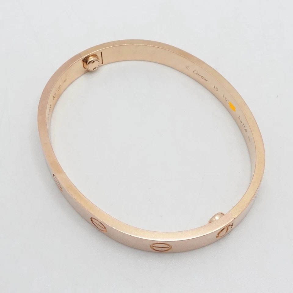 CARTIER LOVE BRACELET 18K ROSE GOLD - SIZE 16 - BOX & POUCH: CARTIER LOVE BRACELET 18K ROSE GOLD - SIZE 16 - BOX & POUCH INCLUDED Cartier 18K Rose Gold Love Bangle Bracelet " Classic Model " Size - 16 cm Wrist Size - 5.5 - 5.8" (14-14.9'cm) Width - 6.1mm Depth 