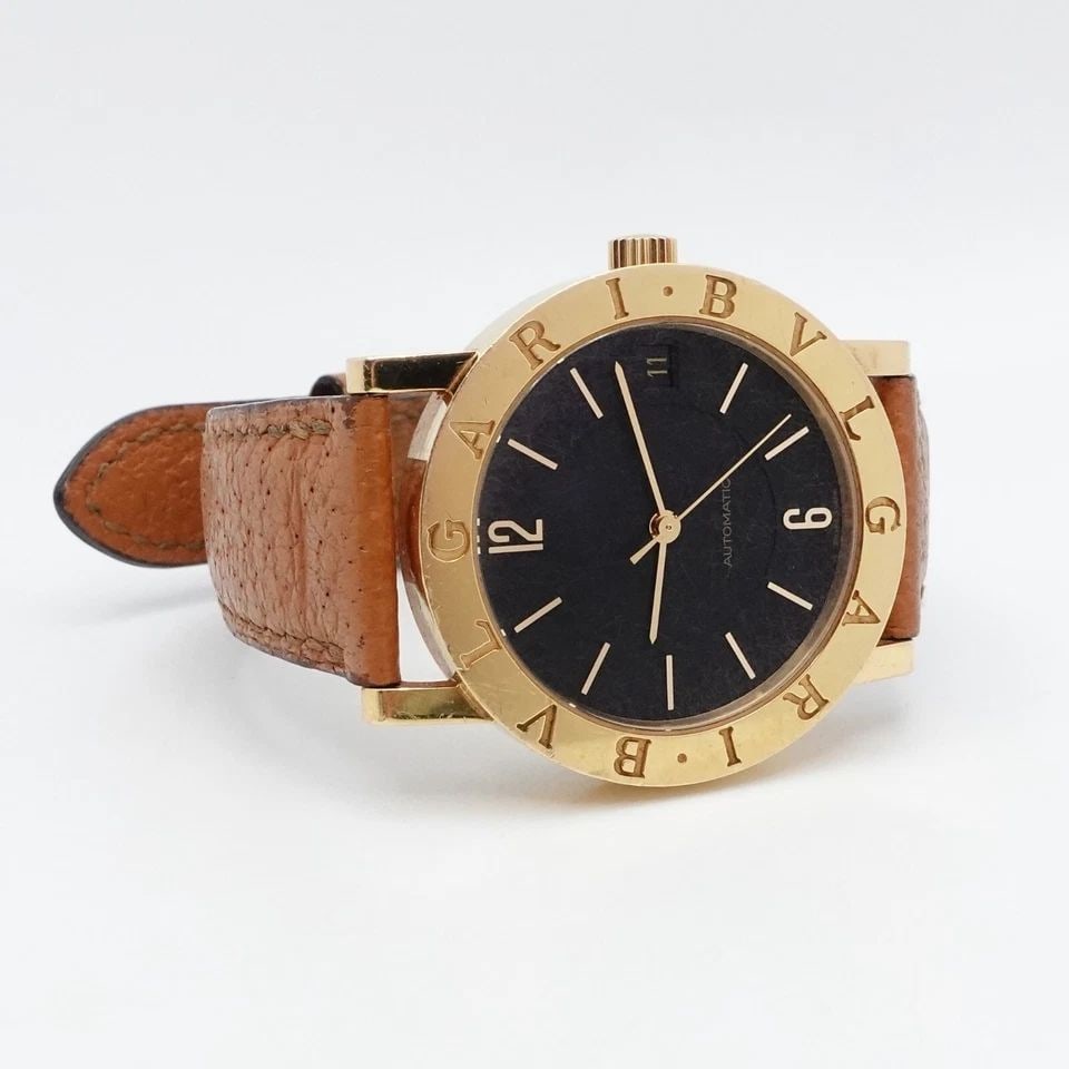 BVLGARI BB33GL 18K YELLOW GOLD BLACK DIAL AUTOMATIC WATCH - 33MM: BVLGARI BB33GL 18K YELLOW GOLD BLACK DIAL AUTOMATIC WATCH - 33MM Bvlgari BB33GL 18K Yellow Gold Black Dial Automatic Watch Case Size - 33mm Total Length - 9" Long Wrist Size - Min 6.5" - 7.75" Max Est