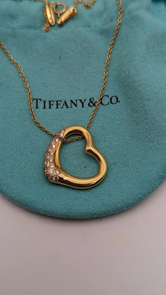 TIFFANY & CO 18K GOLD ELSA PERETTI .38CT DIAMOND OPEN HEART PENDANT NECKLACE 16": Tiffany & Co. 18K Yellow Gold Elsa Peretti Open Heart Diamond Pendant Necklace Length - 16" Pendant Size - 21mm Total Weight - 8.0 Gram Excellent Condition & Very Well Kept Pouch NOT Included