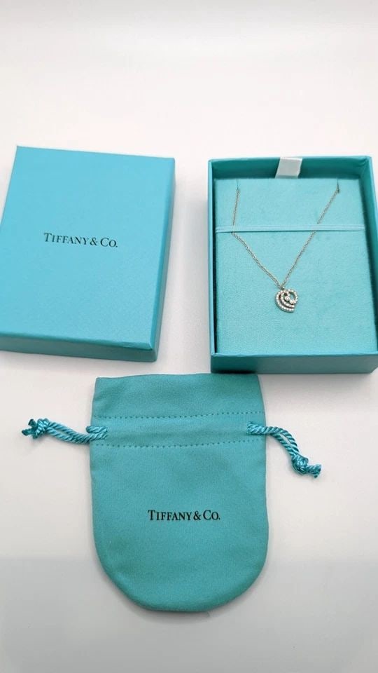 TIFFANY & CO. PLATINUM DIAMOND HEART PENDANT NECKLACE - 16" LONG: Tiffany & Co. Platinum Diamond Heart Pendant Necklace Length - 16" Long Pendant Size - 10mm Total Weight - 3.1 Grams Excellent Condition & Very Well Kept Box & Pouch Included