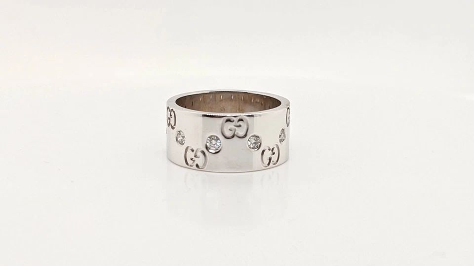 AUTHENTIC GUCCI ICON 18K WHITE GOLD DIAMOND LOGO WIDE BAND RING - SIZE 6: AUTHENTIC GUCCI ICON 18K WHITE GOLD DIAMOND LOGO WIDE BAND RING - SIZE 6 Gucci ICON 18K White Gold Diamond Logo Band Ring Ring Size - 6 Width - 9mm Total Weight - 10.3 Grams Excellent Condition & Very