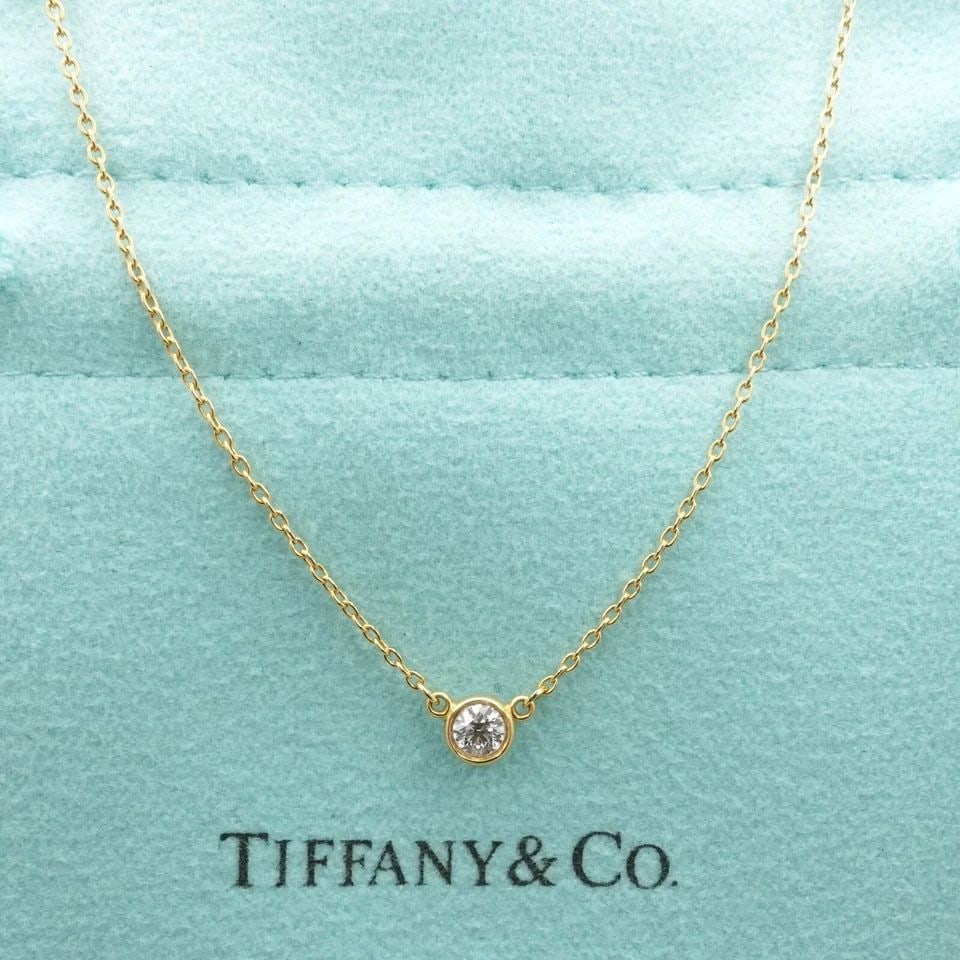 TIFFANY & CO. PERETTI DIAMONDS BY THE YARD SINGLE DIAMOND BRILLIANT NECKLACE: TIFFANY & CO. PERETTI DIAMONDS BY THE YARD SINGLE BRILLIANT SOLITAIRE NECKLACE Tiffany & Co. Elsa Peretti Diamonds By The Yard Bezel Round Brilliant Cut Solitaire Necklace Length - 18.75" Long Chain W