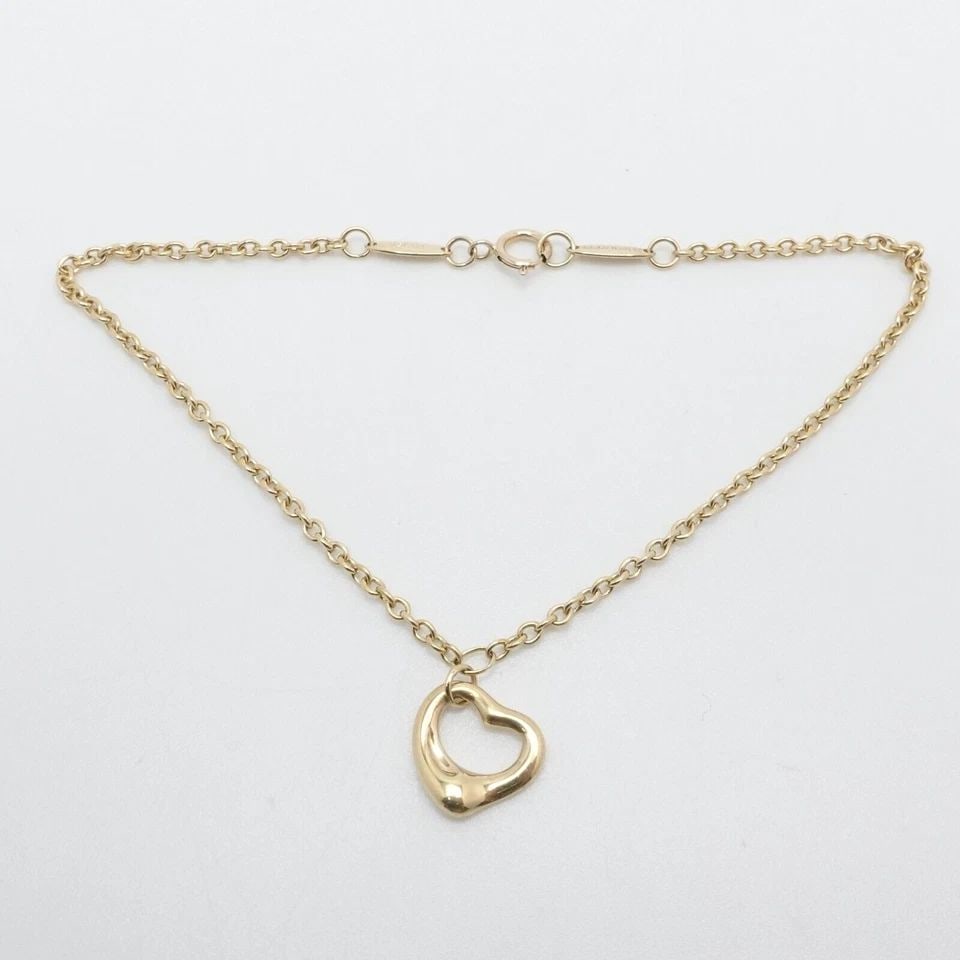 TIFFANY & CO. ELSA PERETTI 18K YELLOW GOLD OPEN HEART CHAIN BRACELET 8" LONG: Tiffany & Co. Elsa Peretti 18K Yellow Gold Open Heart Charm Dangle Chain Bracelet Length - 8" Long Fits up to Wrist Relax 7.5" - 7.75 Snug Fit Chain Width - 2mm Thick Charm Width - 11mm Est. Retail Pr