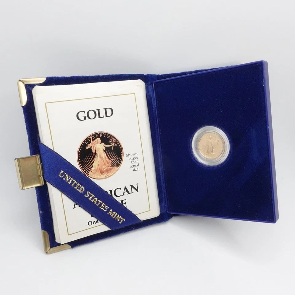 1990 P AMERICAN EAGLE 1/10 OZ. GOLD $5 COIN OGP COA: 1990 P American Eagle 1/10 Troy Oz. Gold $5 Coin Diameter - 16.50 Weight - 3.393 Grams Composition - 91.67% Gold | 3% Silver | 5.33% Bal. Copper OGP Blue Velvet Case & COA Included