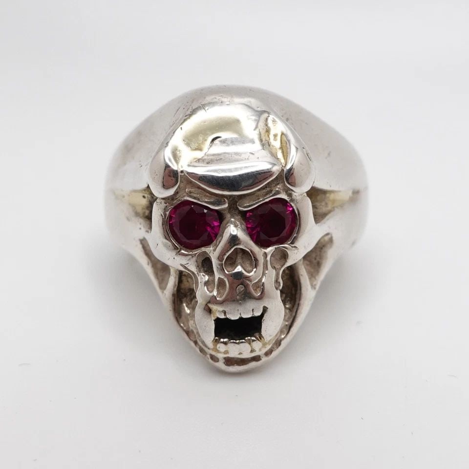 BILL WALL LEATHER STERLING SILVER RED STONE SECRET SKULL RING - SIZE 7.25 PAPER: BILL WALL LEATHER STERLING SILVER RED STONE SECRET SKULL RING - SIZE 7.25 PAPER Bill Wall Leather Sterling Silver Red Stone Secret Skull Heavy Ring Size - 7.25 Band Width - 6mm Height - 23mm Total Wei