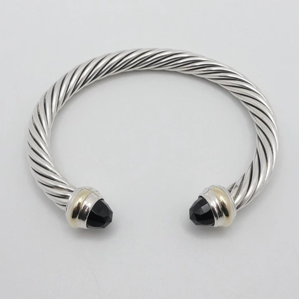 DAVID YURMAN STERLING SILVER 14K YELLOW GOLD ONYX 7MM CABLE CUFF MEDIUM BRACELET: David Yurman Cable Classic Sterling Silver & 14K Yellow Gold Black Onyx Gemstone Cuff Medium Bracelet Fits up to Relax 6" - 6.5" Snug Wrist Width - 7mm Thick Est. Retail - $800 USD Total Weight - 40.3