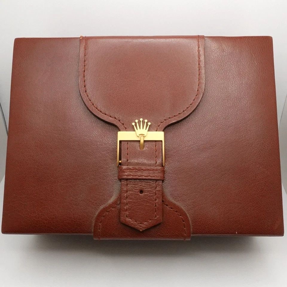 ROLEX 71.00.06 S.A GENEVE SUISSE BROWN LEATHER & WOOD WATCH BOX WITH CARD CASE: ROLEX 71.00.06 S.A GENEVE SUISSE BROWN LEATHER & WOOD WATCH BOX WITH CARD CASE Vintage Montress Rolex S.A Geneve Suisse Leather & Wood Watch Box Ref. # 71.00.06 Height - 2.75" Length - 7.5" Width - 5.