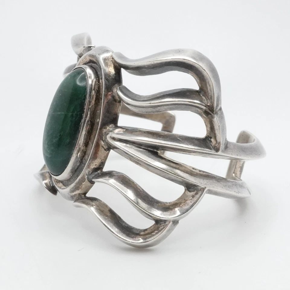 TAXCO STERLING SILVER MEXICO CABOCHON GREEN GEMSTONE CUFF BRACELET 6.5" WRIST: TAXCO STERLING SILVER CABOCHON GREEN GEMSTONE CUFF BRACELET 6.5" WRIST Vintage Taxco Sterling Silver Oval Green Gemstone Cuff Bracelet Fits up to 6.5" Wrist Height - 1.8" Diameter - 2.2"(58mm) Gemston