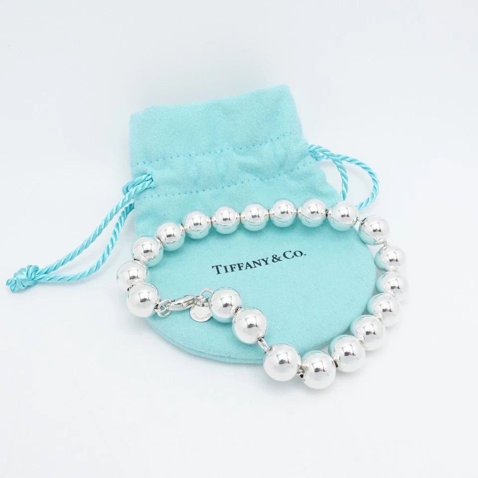 TIFFANY & CO. HARDWEAR STERLING SILVER BALL BRACELET - SIZE 8.75" LONG POUCH #Q3: Tiffany & Co. Sterling Silver HardWear Ball Bracelet Size - 8.75" Long Wrist Size - Relax 7.25" - 7.5" Snug Fit Chain Width - 10mm Est. Retail Price - $675 USD Total Weight - 21.2 Grams Very Great & P