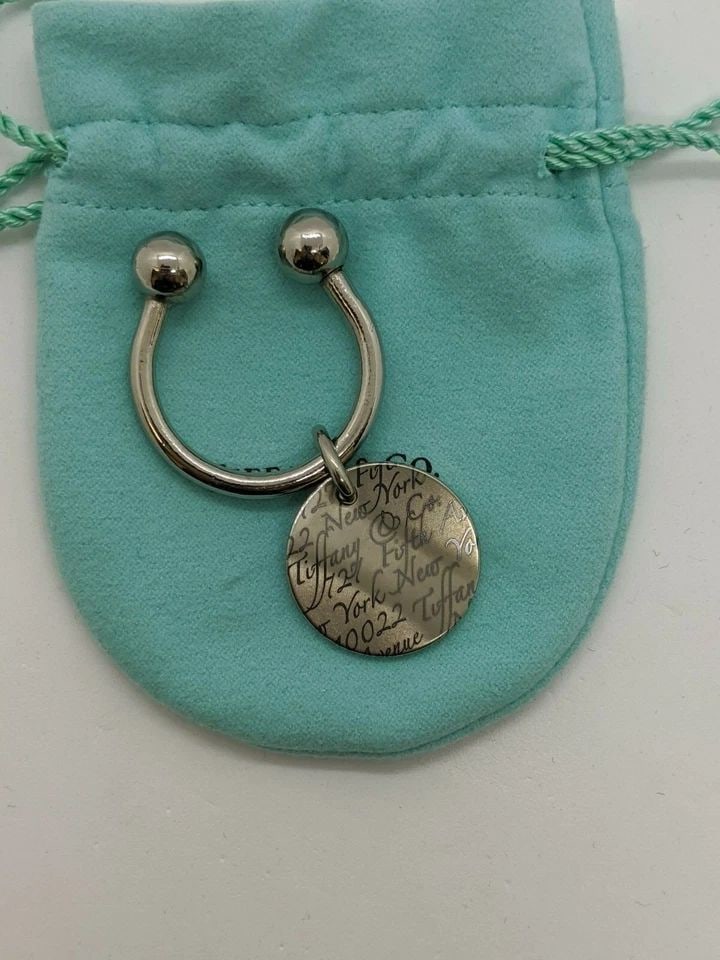 TIFFANY & CO. TITANIUM WAVY NOTES FIFTH AVENUE NY ROUND TAG KEY RING (1 of 2)