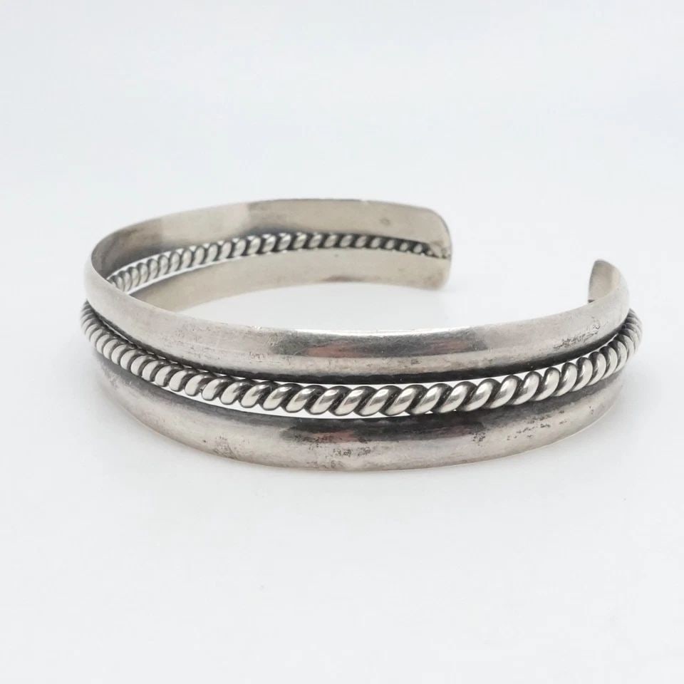 RF STERLING SILVER NAVAJO CUFF BRACELET 6.5" WRIST: RF STERLING SILVER NAVAJO CUFF BRACELET 6.5" WRIST Signed RF Sterling Silver Navajo Cuff Bracelet Fits up to 6.5" Wrist Cuff Width - 11mm Diameter - 58mm Total Weight - 13.2 Grams **This cuff is flexi