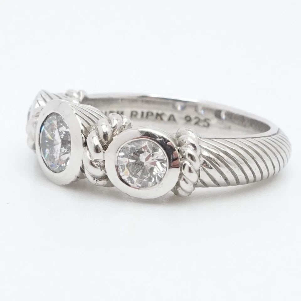 JUDITH RIPKA STERLING SILVER 3 ROUND CLEAR CUBIC ZIRCONIA CABLE RING SIZE 6.25: JUDITH RIPKA STERLING SILVER 3 ROUND CLEAR CUBIC ZIRCONIA CABLE RING SIZE 6.25 Judith Ripka Sterling Silver 3 Round Clear Cubic Zirconia Cable Ring Size - 6.25 Band Width - 3mm Height - 7mm Total Weig